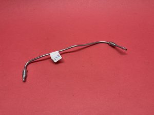 Pipe from brake accumulator to distribution block spring system