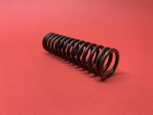 Handbrake cable spring