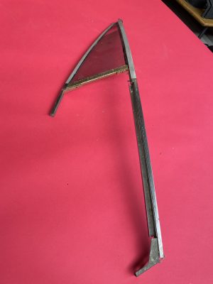 Door triangle window in frame left (tinted) NOS