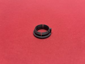 Height adjustment of plastic bushing by chassis beam LV