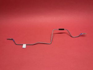 Pipe from coupling in torsion box to T-piece left rear hydraulic shield. Highlighted in blue.