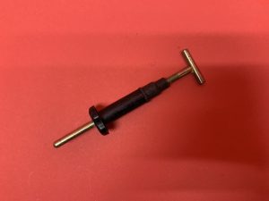 Headlight height adjustment swivel front piston