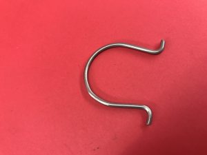 Headlight height control mounting spring front piston housing