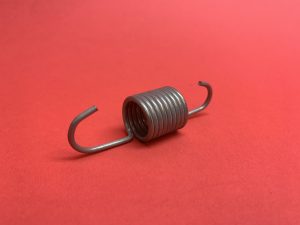 Handbrake cable spring mid top of box