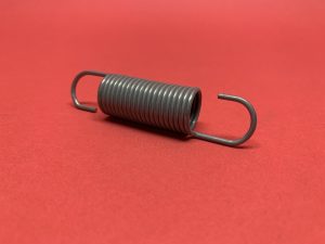 Headlight height control pull spring