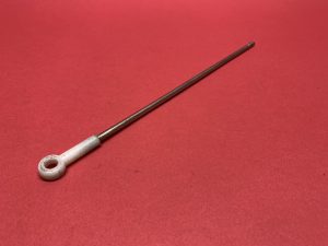 Headlight damper connecting rod with plastic eye